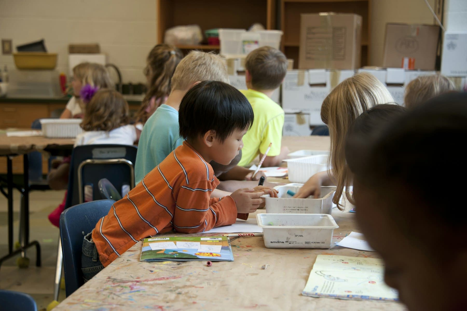 A primary-age student working through an exercise
